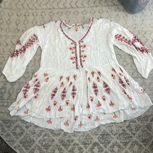 White shirt with embroidery. Size large, from a local boutique